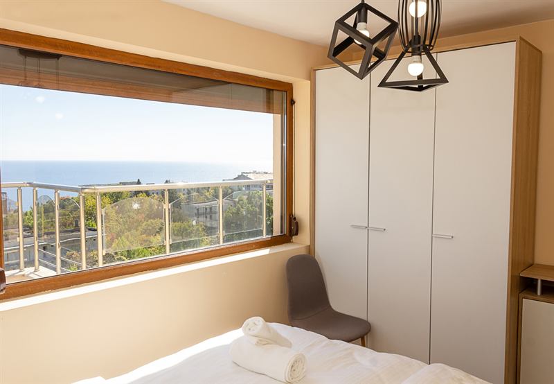 Double bedroom with sea view and designer lighting